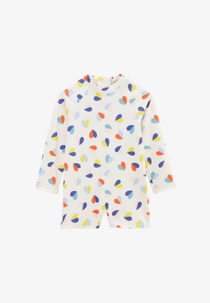 Combinaison de bain UV à manches courtes avec une base blanche et des motifs en forme de gouttes multicolores. Présente un col montant et une coupe courte au niveau des jambes.