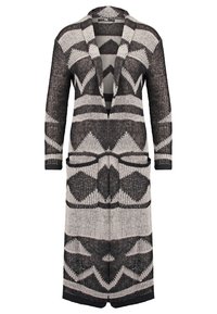 Cardigan en maille avec un motif géométrique noir et blanc, ouvert sur le devant, manches longues et deux poches avant. Tissu léger et texturé.