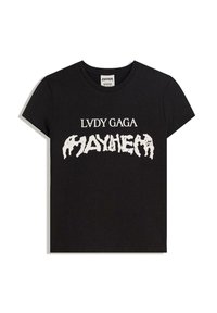 Černé bavlněné tričko s odvážným bílým textem "LVDY GAGA MAYHEM" v stylizovaném písmu. Standardní kulatý výstřih a krátké rukávy.