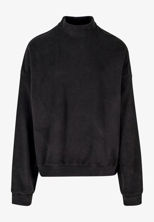 Fekete pulóver magas nyakkal, hosszú ujjakkal és laza szabással. Puha anyagból készült, sima textúrával és bordázott mandzsettákkal.