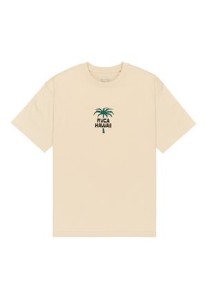 Beige lyhythihainen T-paita, jossa on vihreä palmukuva ja "RVCA HAWAII" -teksti rinnan keskellä.