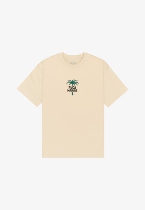 Beige lyhythihainen T-paita, jossa on vihreä palmukuva ja "RVCA HAWAII" -teksti rinnan keskellä.