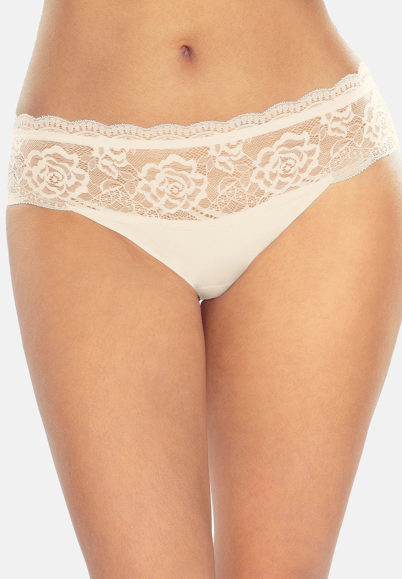 Slips aus einer Kombination von Spitze und Baumwolle mit einem floralen Spitzenbund, gewellten Kanten und neutraler beiger Farbe. Glattes Material mit moderater Bedeckung.