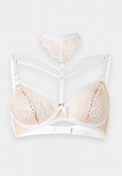 Creme-weißer Spitzen-BH mit dekorativen Frontträgern, die an ein passendes Spitzen-Choker-Halsband anschließen.