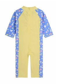 Mono de manga larga en amarillo con patrón floral azul, que presenta una cremallera en la parte trasera y una tela suave y elástica para mayor comodidad.