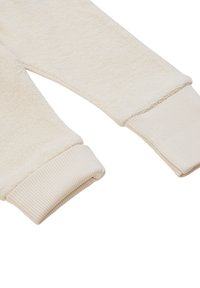Crème-kleurige sweatshirtmouwen met zacht, textuurachtig materiaal en ribgebreide manchetten voor een snug fit. Naadloze constructie langs de randen.