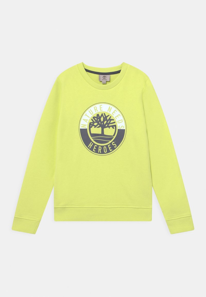 Sudadera amarilla brillante de manga larga, con puños y dobladillo acanalados, que presenta un diseño gráfico circular que dice "LA NATURALEZA NECESITA HÉROES."