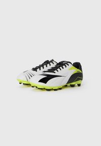 Football boots with a white and black synthetic upper, featuring bright yellow soles and black studs; diagonal stripes detail on sides.