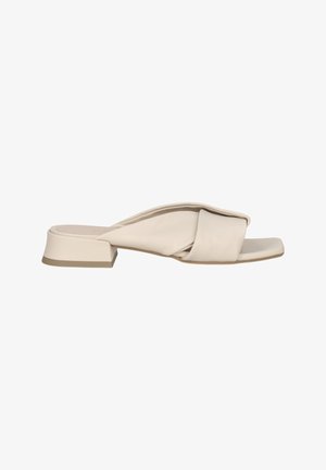 Beige Leder-Slide-Sandalette mit geknotetem Design und quadrater Zehenpartie. Besitzt einen niedrigen Blockabsatz und eine glatte Textur.
