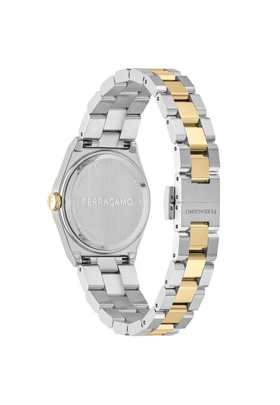 Silver stainless steel watch with a hexagonal case, yellow gold accents on the band, and a smooth, polished surface. Engraved logo on the back.