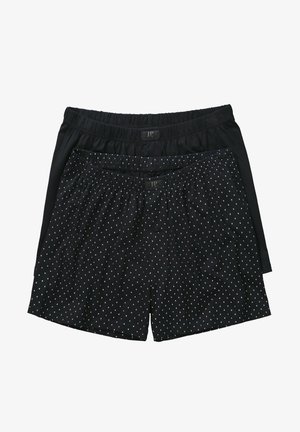 Czarne bawełniane bokserki, jedna w jednolitym kolorze, a druga w małe białe kropki, z elastycznym paskiem w talii i guzikowym zapięciem. Miękka tekstura i luźny krój.