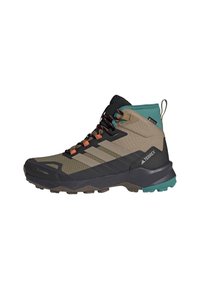 Outdoor hiking boot in beige, black, and teal with orange accents, featuring waterproof Gore-Tex and rugged sole for rough terrain.