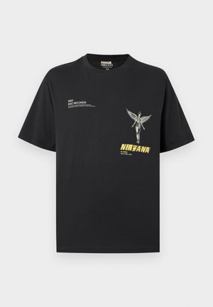 T-shirt noir avec une figure anatomique ailée, texte "Nirvana" en jaune, texte "1993 DGC Records" et détails de l'album sur le devant.