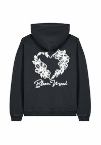 Felpa nera con un grande design a cuore floreale bianco e il testo "Bloom Mood" stampato sotto. Presenta un cappuccio con cordini e polsini a coste.
