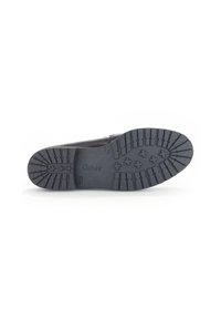Zwarte leren schoen met een gestructureerde rubberen zool met een patroon voor grip. Inclusief branding aan de onderzijde.
