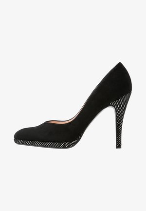 Sorte ruskinds pumps med spidse tåer, stiletto hæl og et mønstret polka dot-anslag ved bunden. Glat finish med let tekstur.