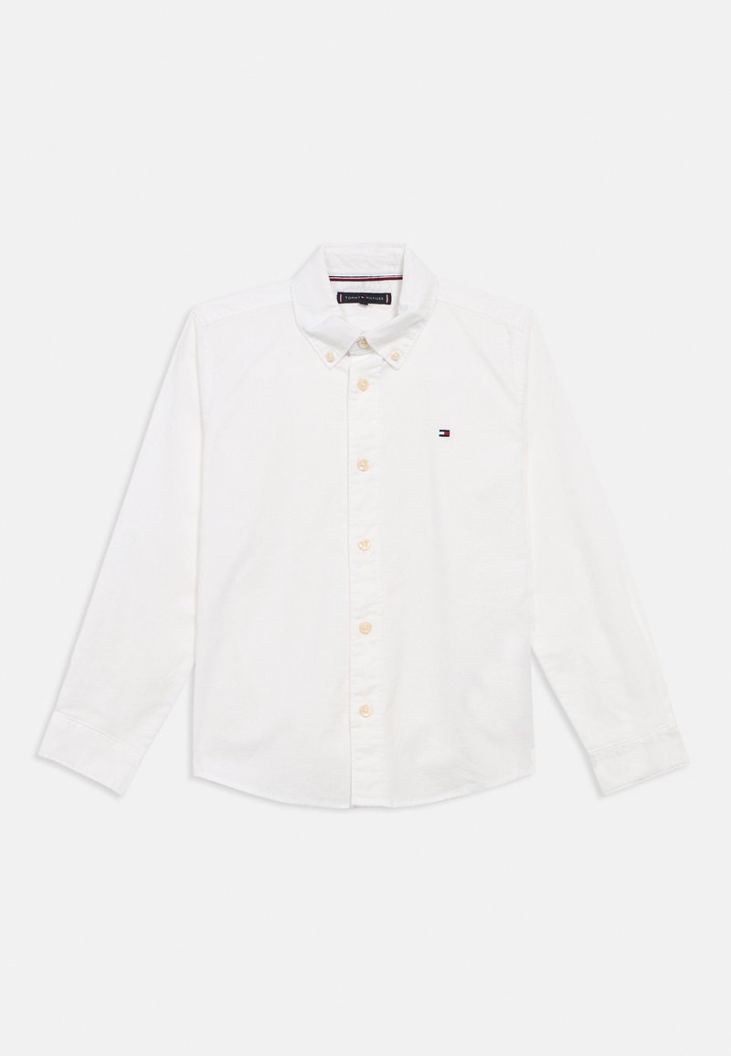 Camisa branca de botão, com mangas longas, em material de algodão, com colarinho dobrável e pequeno logótipo bordado no lado esquerdo do peito.