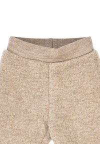 Pantaloni in pile marrone con un materiale morbido e strutturato. Presentano un'ampia fascia elastica in vita e un design semplice e lineare.