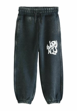 Black elastic waist joggers with drawstring, side pockets, elastic cuffs, and white distorted text "ALSAINTS LONDON" on right thigh.