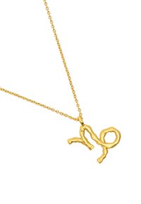 Złoty naszyjnik z teksturowanym, abstrakcyjnym zawieszką w kształcie "nie" na delikatnym łańcuszku. Zawieszka ma organiczny, nieregularny kształt.