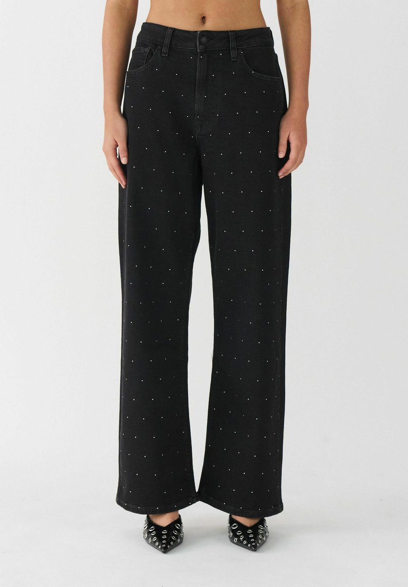 High-waisted black denim wide-leg pants with silver studs evenly spaced across the front, featuring a classic button closure and pockets.