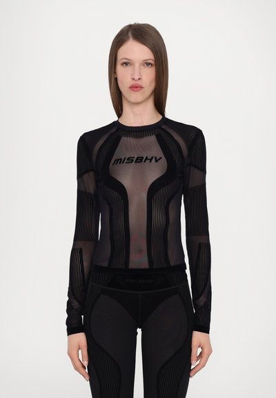 Black top with long sleeves featuring sheer mesh and textured stripe patterns. "MISBHV" logo prominently displayed on the front.