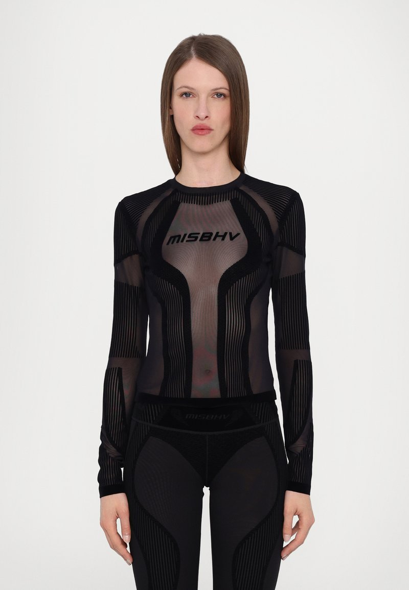 Black top with long sleeves featuring sheer mesh and textured stripe patterns. "MISBHV" logo prominently displayed on the front.