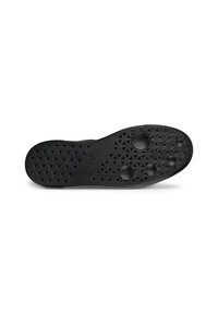 Semelle de chaussure en caoutchouc noir avec des motifs texturés comprenant des étoiles et des creux circulaires, présentant une forme plate et large avec des bords lisses.