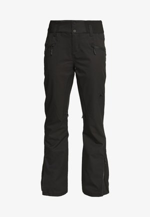 Juodos izoliacijos kelnės, pagamintos iš minkštosios medžiagos, su dviem užtrauktukais priekyje ir užtrauktukais kulkšnų srityje vėdinimui.