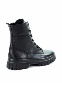 Botas de cuero negras hasta el tobillo con punta redonda, parte frontal con cordones, suela de goma gruesa y dos costuras laterales para mayor detalle.
