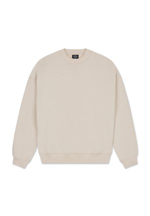 Beżowy sweter w miękkim materiale z okrągłym dekoltem, opadającymi ramionami, długimi rękawami oraz ściągaczami przy mankietach i u dołu. Prosty i minimalistyczny design.