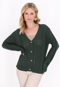 Cardigan lavorato a maglia di un verde scuro con scollatura a V, chiusura con bottoni, motivo a traforo intricato e polsini e orlo a coste.