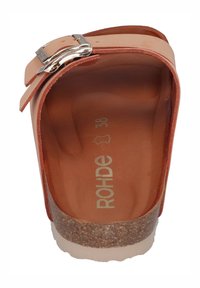 Cork-soled clogs with a smooth, light orange leather strap featuring a silver buckle and tan footbed, marked with “ROHDE 38.”