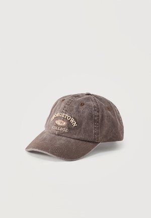 Worn brown baseball cap with curved brim, embroidered with "Georgetown 1789 College" in cream-colored thread.