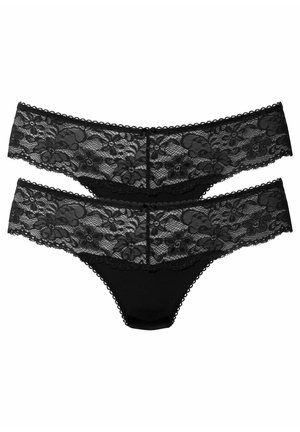 Schwarze Spitzenstring-Unterwäsche mit floralem Muster, weichem Stoff und gewelltem Saum an den Kanten. Zwei Paare sind ausgestellt.