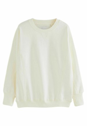 Felpa color crema a maniche lunghe con scollo girocollo, polsini e orlo a costine, con dettagli sottili di cuciture sul davanti e sui lati.