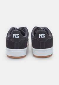 Suede dark navy sneakers with white logo, contrasting white midsole, and gum rubber outsole. Two parallel stripes on padded collar.
