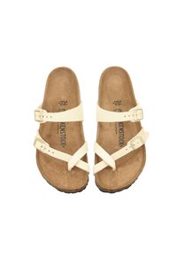 Sandali beige a due cinturini con fibbie regolabili, una soletta in sughero e una suola in gomma testurizzata; design minimalista con cinturini incrociati.