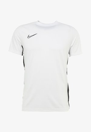 Valkoinen Nike-t-paita, jossa mustat sivukoristeet, lyhyet hihat, pyöreä pääntie, kevyt kangas ja pieni logo rinnassa.