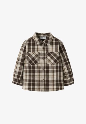 Brun og kremfarvet ternet skjorte i flannelmateriale, med krave, knaplukning foran og to brystlommer med diamantformede detaljer.