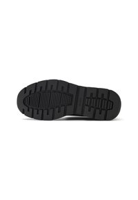 Black rubber shoe sole with a textured tread pattern featuring ridges and grooves for traction. Includes branding in the center.