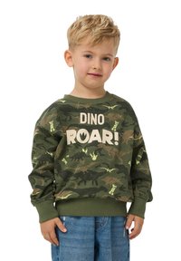 Zielona bluza w kamuflażu z wzorami dinozaurów i napisem "DINO ROAR!" w beżu. Żebrowane mankiety i dekolt. Miękka tkanina.
