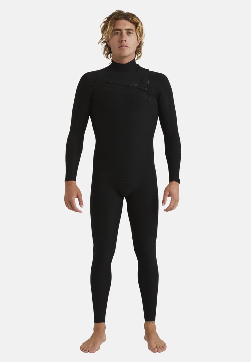 Black wetsuit with long sleeves, featuring shoulder zip, textured knee pads, snug fit, and minimal seams for reduced water entry.