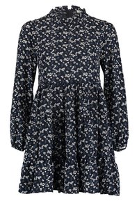 Marinblå blommig klänning med långa ärmar, volangkrage och lagd kjol. Har små vita och blå blommönster på mjukt tyg.