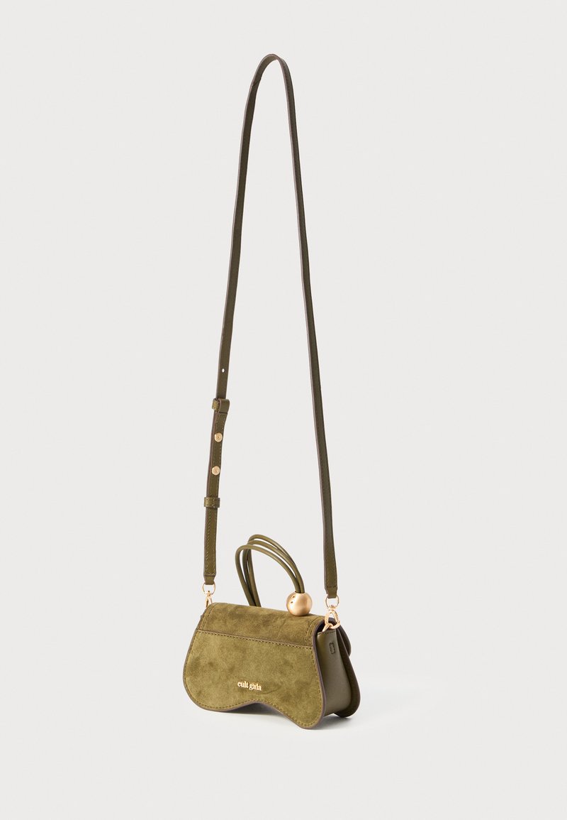 Green suede handbag with a curved shape, gold hardware accents, and an adjustable strap, featuring a decorative handle and logo detail.