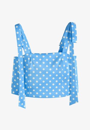 Top albastru scurt cu buline albe, cu bretele late legate în funde.