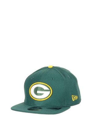 Green cap made of a textured fabric featuring an embroidered green and white logo inside a yellow oval. Flat brim and adjustable snapback.
