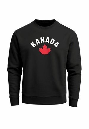 Black sweatshirt with crew neckline, featuring white text "KANADA" above a red maple leaf design on the front. Soft fabric texture.