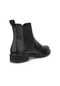 Botas Chelsea de cuero negro con paneles elásticos, una lengüeta y una suela de goma gruesa, con una textura suave y un diseño elegante.