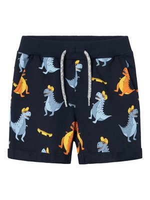 Mörkblå shorts med dinosauriemönster i blått, orange och gult, med dragsko i midjan och uppvikta fickor för designdetalj.